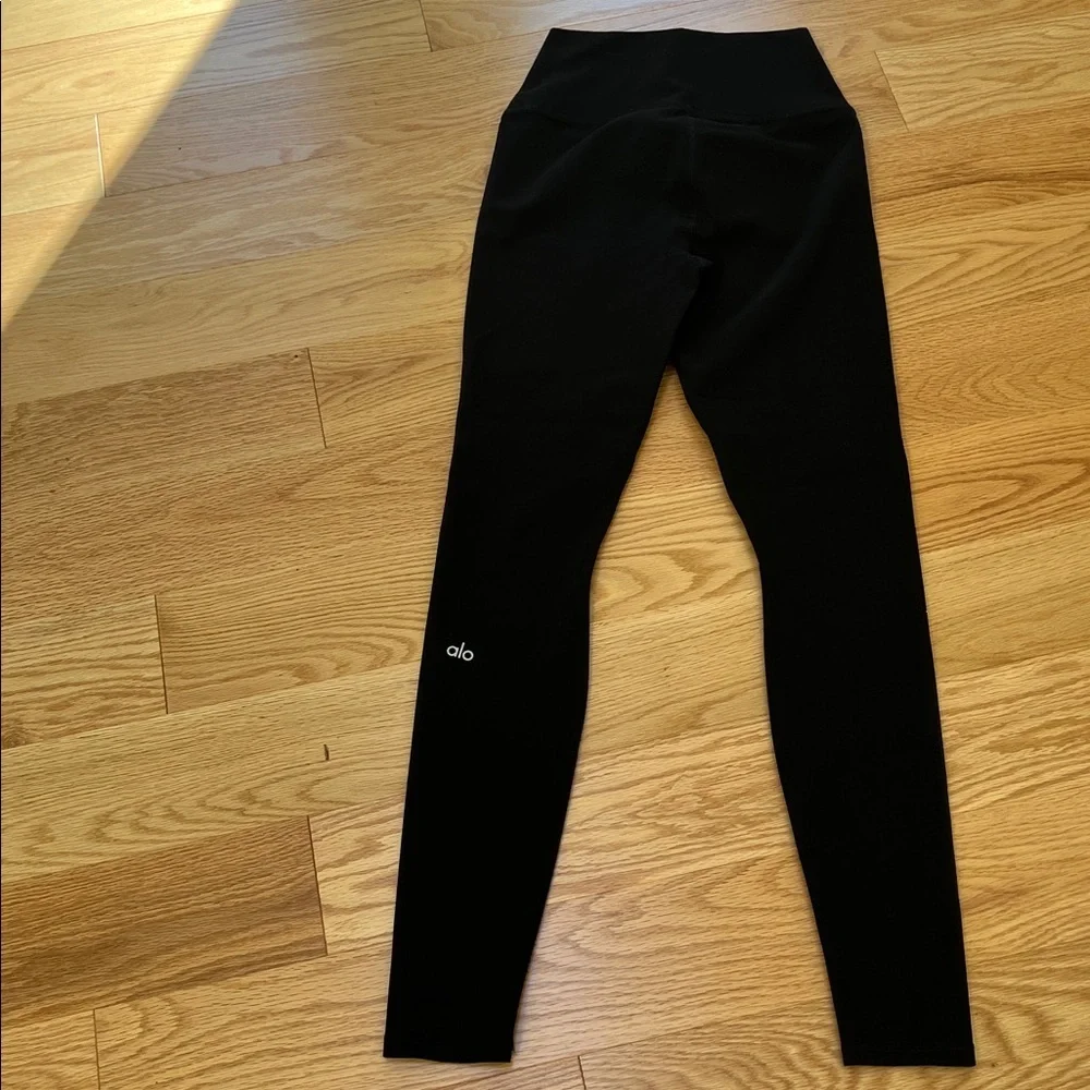 ALO Yoga black ripped high waist warrior leggings.